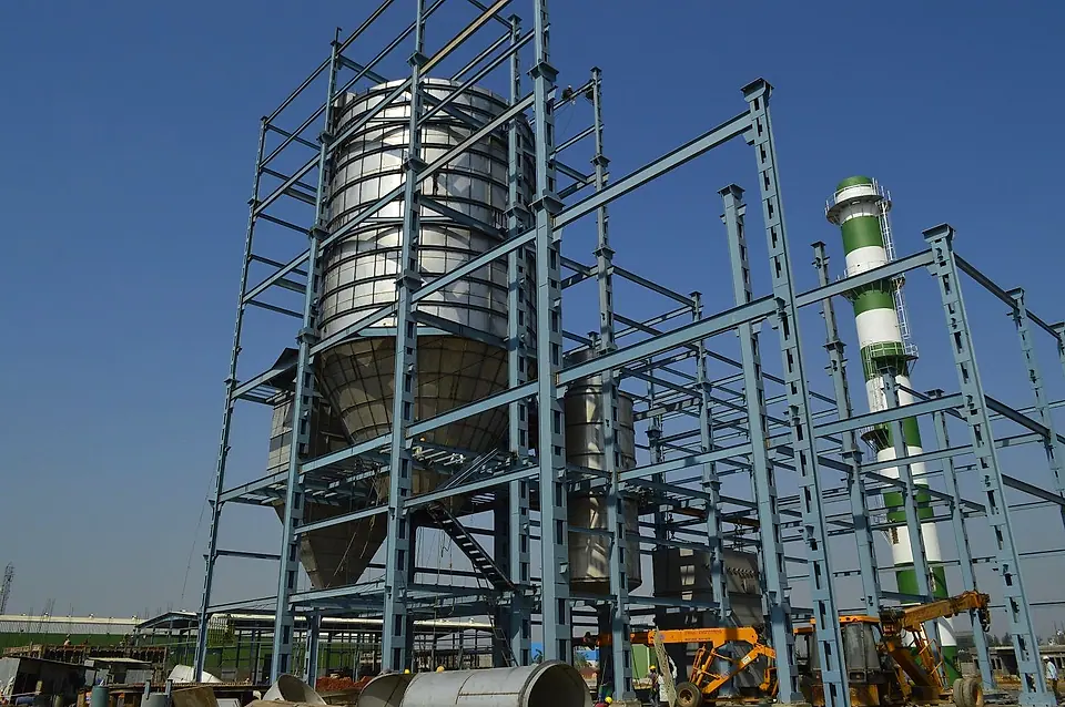 Acmefil effluent spray dryer: stainless drying chamber in its steel structure under a blue sky