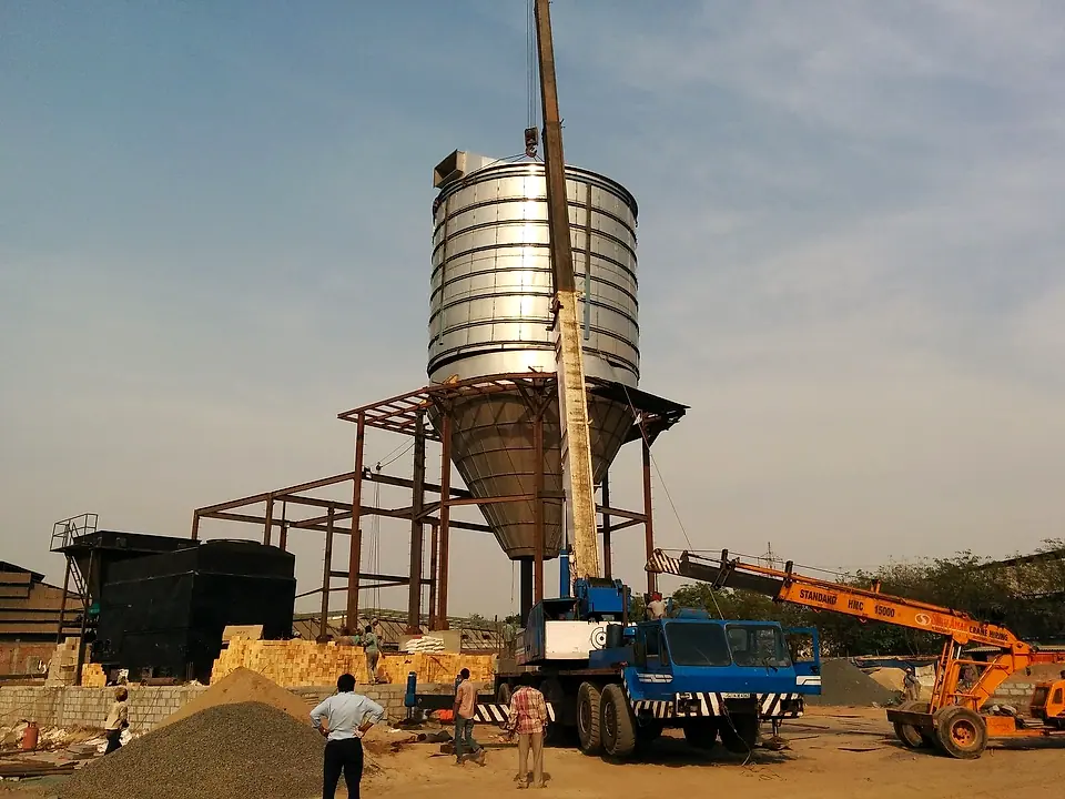 Acmefil spray drying chamber being lifted into place by crane during erection
